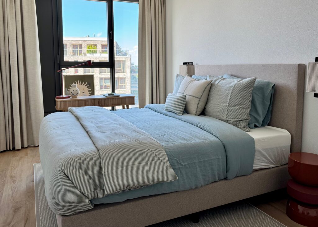 Bedroom with bed and window, Brinktoren apartment